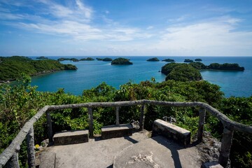 Canvas Print - Scenic shot of islands in the 1000 Islands national park in Philippines seen from a wooden balcony