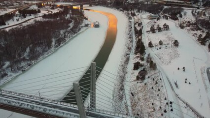 Poster - Scenic drone view of Tawatina Bridge over the North Saskatchewan river in Edmonton during the sunset