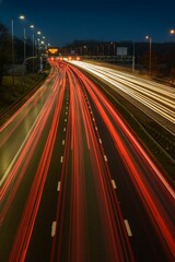 Canvas Print - Light trails from fast moving traffic on M42 motorway at night.