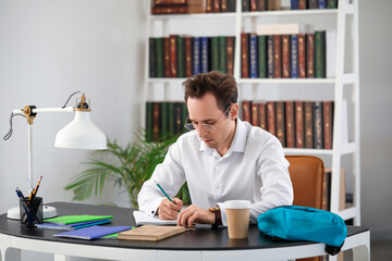 Wall Mural - Male student doing lessons at home