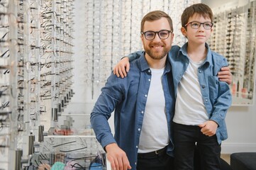 Wall Mural - Family buy glasses. Father in a blue shirt