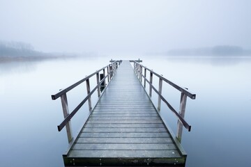 Naklejka na meble Beautiful foggy view of a pier on jetty in the Netherlands