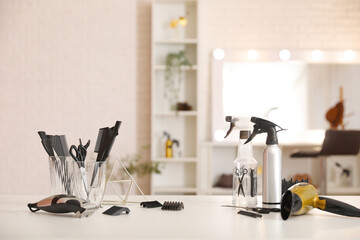 Canvas Print - Different hairdressing tools on table in beauty salon