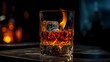 © ArturSniezhyn - Glass with whiskey and ice cubes on the table, warm cozy atmosphere.