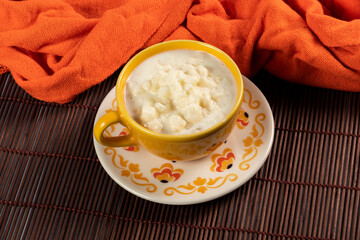 cup of canjica, typical food consumed in the Brazilian Festa Juninas