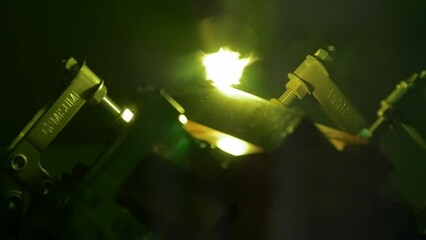 Sticker - Closeup of welding tool used on proton laser in a dark factory