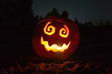 Wall Mural - Closeup of glowing Halloween pumpkin face