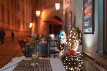 Poster - Beautiful view of a decorated table in a cozy restaurant at night