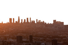 Smoggy Orange Sunrise Cityscape View Of Los Angeles And Hollywood From Hilltop In The Santa Monica Mountains.    Isolated With Cut Out Sky.