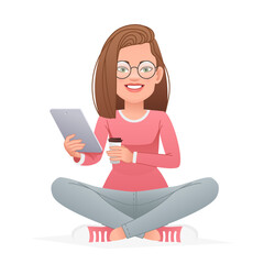 Wall Mural - Happy girl in glasses sits cross-legged with a tablet and a glass of coffee in her hands. Beautiful white slender woman sits in a lotus position