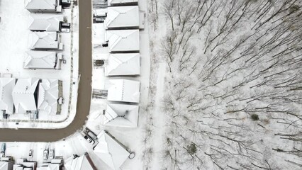 Sticker - Aerial view of a town with houses covered in snow on a cold winter day