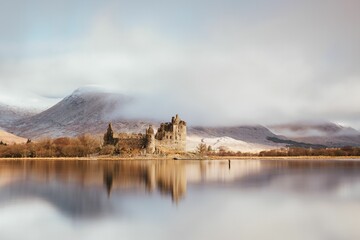 Wall Mural - Aerial view of Kilchurn castle surrounded by water in Scotland