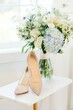 Vertical shot of a pair of white wedding shoes