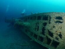 Scuba Divers Taking Photos And Exploring  U Boat Wreck Ww2 Submarine