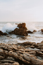 Waves Hit Against The Rocky Shoreline