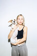 © Köt & Friends/Stocksy - Surprised Woman Holding A Confused Dog