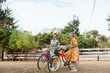 © ByLorena/Stocksy - Two teen girls with vintage Bikes outdoor in summer