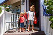 © ByLorena/Stocksy - Children at terrace house with superhero capes