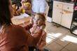 © Serena Burroughs/Stocksy - mother and daughter together in kitchen