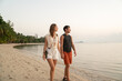 © Hernandez & Sorokina/Stocksy - Couple Having A Walk In The Beach Of Thailand