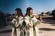 © Ezequiel Giménez/Stocksy - Female doing makeup against mirrored wall in sunshine