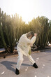 © Ezequiel Giménez/Stocksy - Female dancer moving on street