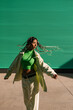 © Ezequiel Giménez/Stocksy - Carefree woman with flying hair walking on paved street
