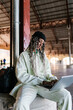 © Ezequiel Giménez/Stocksy - Focused woman working on laptop in room