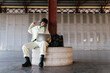 © Ezequiel Giménez/Stocksy - Stylish woman working on laptop in hangar