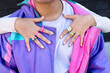 © Lucas Ottone/Stocksy - Urban fashion trends, hand with rings and nails