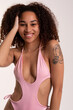 © Valentina Barreto/Stocksy - Attractive mixed race woman in swimwear