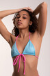 © Valentina Barreto/Stocksy - Chic female model color studio summer shoot