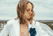 © Ivona Zivulj/Stocksy - Portrait of Beautiful Bride on Rooftop