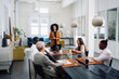 © Bruce and Rebecca Meissner/Stocksy - Boardroom Meeting