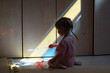 © Anfisa&friends/Stocksy - kid playing toys, light and shadows