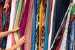 © Hernandez & Sorokina/Stocksy - Female Hands Holding Colourful Fabrics