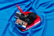 © Juan Moyano/Stocksy - old cameras in a red dustpan