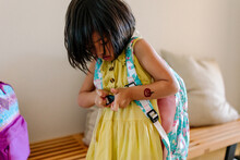 Little Girl Wearing A Backpack, Getting Ready To Go To School