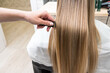 © Alvaro Lavin/Stocksy - hairdresser showing client's freshly styled hair