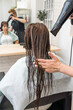 © Alvaro Lavin/Stocksy - woman hairdresser drying long wet hair in hairdresser's salon