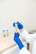 © Alvaro Lavin/Stocksy - doctor showing the plasma specimens extracted from the machine