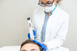 © Alvaro Lavin/Stocksy - doctor injecting blood plasma into the scalp