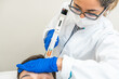 © Alvaro Lavin/Stocksy - doctor injecting blood plasma into the scalp