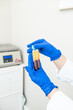 © Alvaro Lavin/Stocksy - doctor showing the plasma specimens extracted from the machine