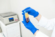 © Alvaro Lavin/Stocksy - doctor showing the plasma specimens extracted from the machine