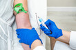 © Alvaro Lavin/Stocksy - doctor drawing blood from patient