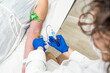 © Alvaro Lavin/Stocksy - doctor drawing blood from patient