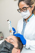 © Alvaro Lavin/Stocksy - doctor injecting blood plasma into the scalp