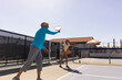 © Raymond Forbes LLC/Stocksy - Partners match on outdoor Pickleball court  friend