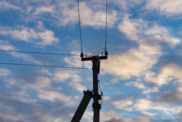 Power line and clouds in the sky